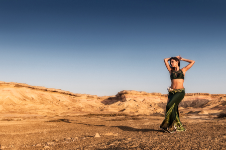 Active woman dancing on plain of the Namibe Desert. Africa. Angola.の写真素材