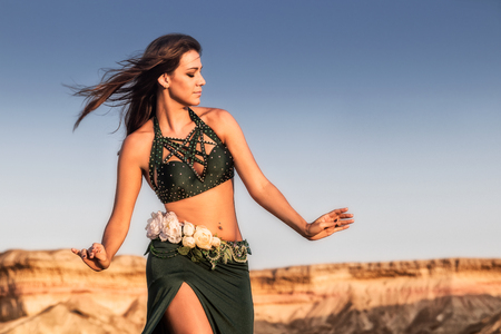 Portrait of Woman dancing on plain of the Namibe Desert. Africa. Angola.の写真素材
