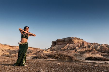 Active woman dancing on plain of the Namibe Desert. Africa. Angola.の写真素材