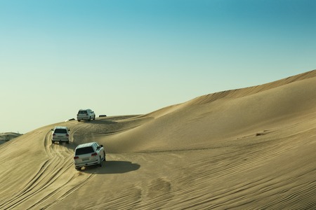 UAE/ABUDHABI - 13 DEZ 2018 - Cars in the Abu Dhabi desert to climb dunes.の写真素材