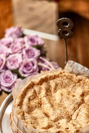 Portuguese traditional cake, sponge cake. on the wooden table with roses.の写真素材