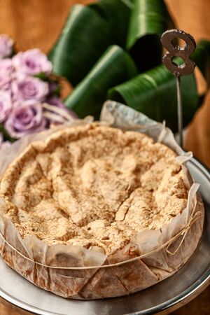 Portuguese traditional cake, sponge cake. on the wooden table with roses.の写真素材