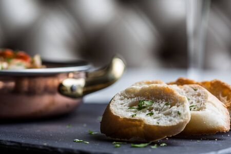 Slices of bread to accompany gourmet dish.の写真素材