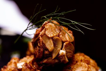 Cheese balls topped with almonds.の写真素材