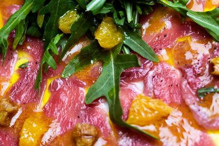 Beautiful carpaccio with cheese and vegetables and in detail.の写真素材