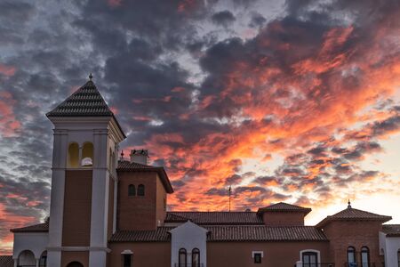 gothic tower with extremely dramatic sunset sky.の写真素材