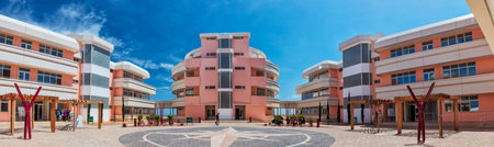 Patio with buildings and blue sky.