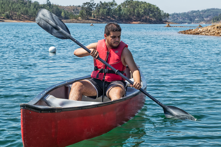 TOMAR/PORTUGAL - 10AUG2019 - Man kayaking on the zezere river.のeditorial素材