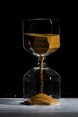hourglass of time isolated on black background.の写真素材