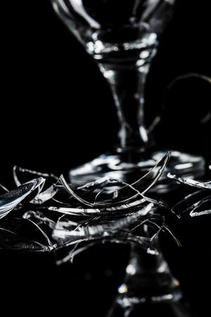 Abstract photograph of broken glass with black background.の写真素材