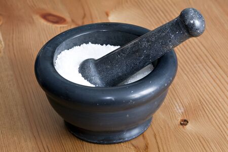 Grey stone mortar on tableの写真素材