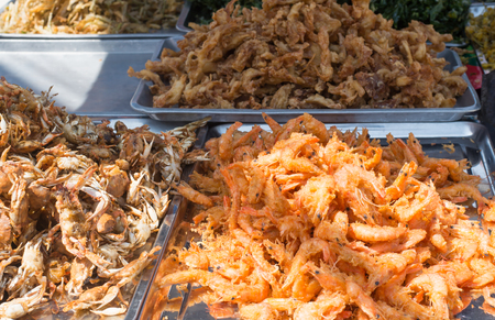 Assorted fried shrimps and fishesの写真素材