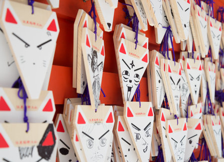 KYOTO, JAPAN - August 12, 2015: Wishing Fox Face at Fushimi Inari Taisha, the Shinto shrine famous...