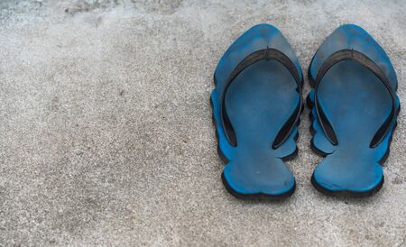Old blue shoes on the floorの写真素材