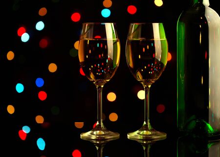 Two wine glasses on holiday backgroundの写真素材