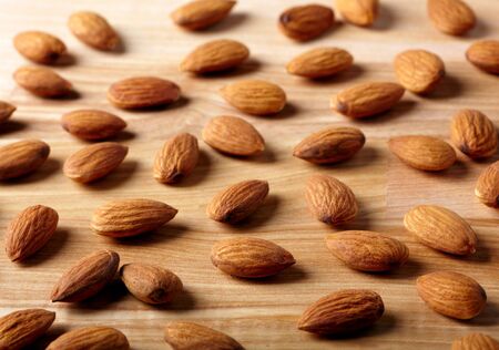 Almonds on wooden backgroundの写真素材