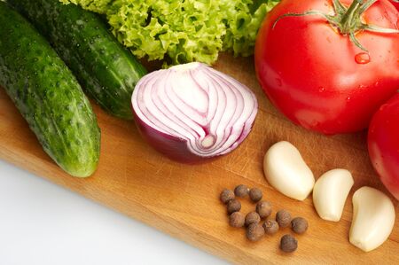 Fresh vegetables on wooden hardboardの写真素材