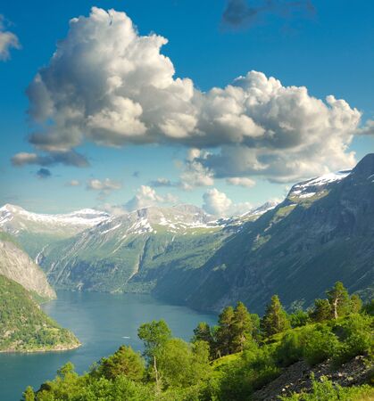 Summer landscape. Blue sky, mountains and fjord の写真素材