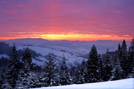 Beautiful sunrise in the winter mountainsの写真素材