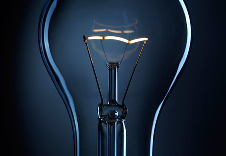 Light bulb over dark background