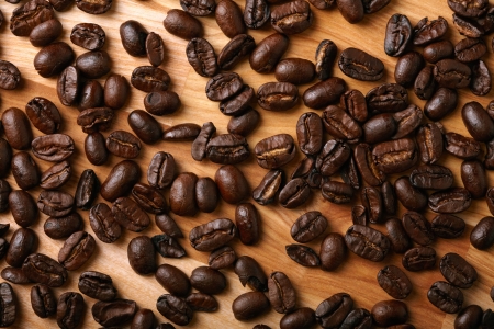 Coffee beans on wooden backgroundの写真素材