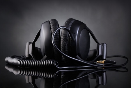 Modern headphones over dark backgroundの写真素材