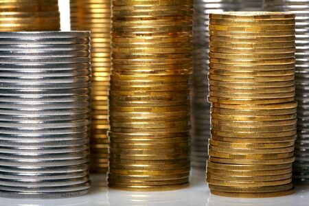 Golden and silver coin stacksの写真素材