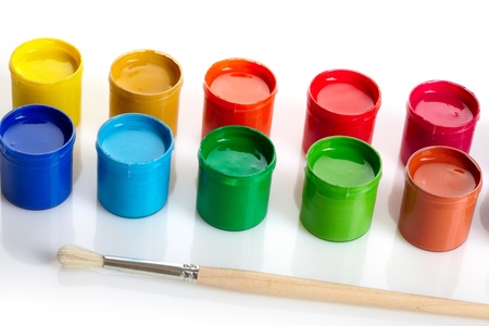 Paint buckets with paintbrush over white backgroundの写真素材