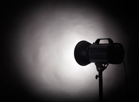 Theater spotlight over black backgroundの写真素材