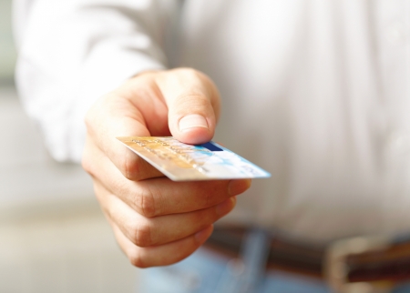 Hand with credit card  Shallow DOFの写真素材