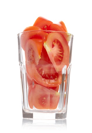Tomato slices in glass isolated on white backgroundの写真素材