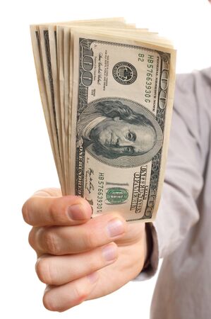 Businessman holding dollars stackの写真素材