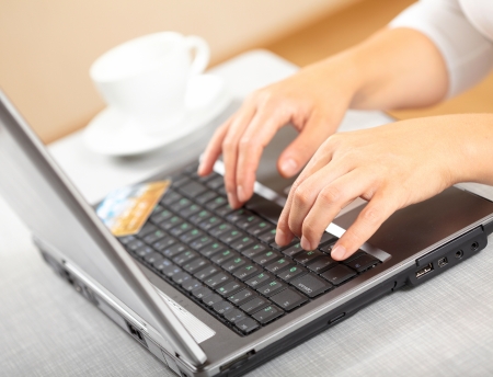 Woman's hands and laptop の写真素材