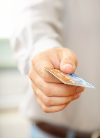 Hand with credit card. Shallow DOF の写真素材