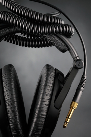 Modern headphones over black backgroundの写真素材
