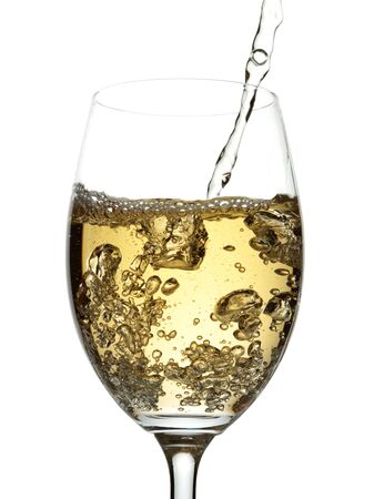 White wine pouring into glassの写真素材