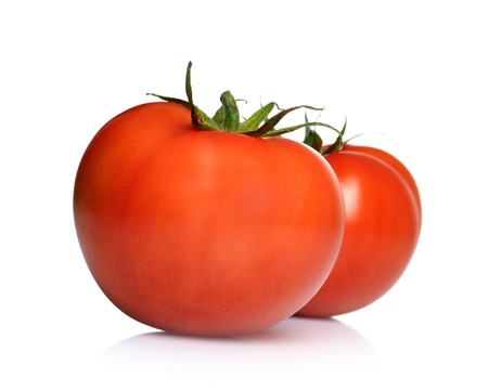Two tomatoes isolated on white background の写真素材