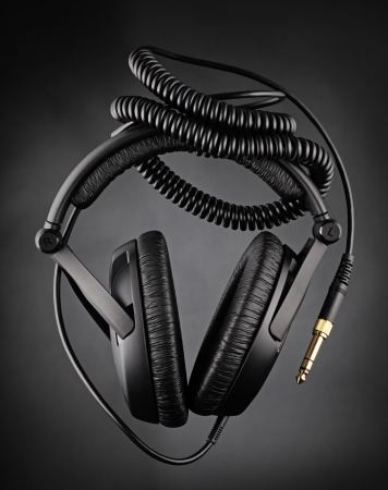 Modern headphones over dark backgroundの写真素材