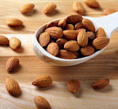 Almonds on wooden backgroundの写真素材