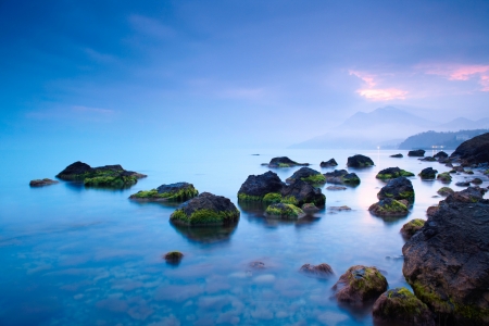 Sea stones at sunsetの写真素材