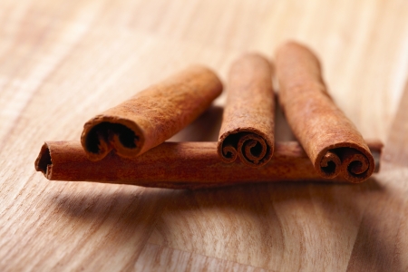 Cinnamon sticks on wooden backgroundの写真素材