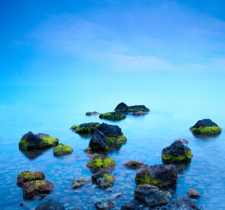 Sea stones at sunsetの写真素材