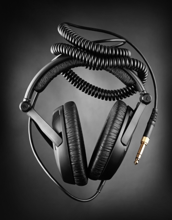 Modern headphones over dark backgroundの写真素材