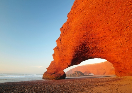 Red archs on atlantic ocean coast. Moroccoの写真素材