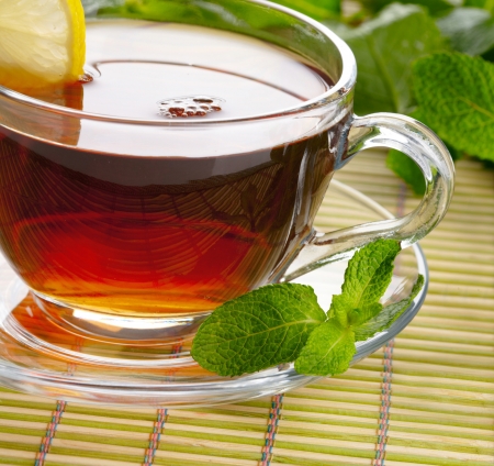 Cup of tea with lemon and mintの写真素材
