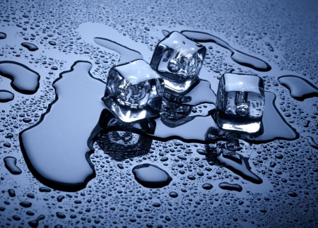 Ice cubes over dark backgroundの写真素材