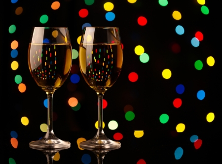 Two wine glasses on holiday backgroundの写真素材