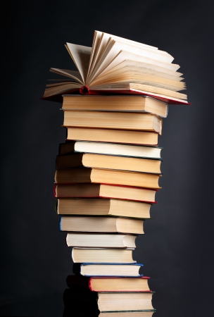Pile of books on a black background の写真素材