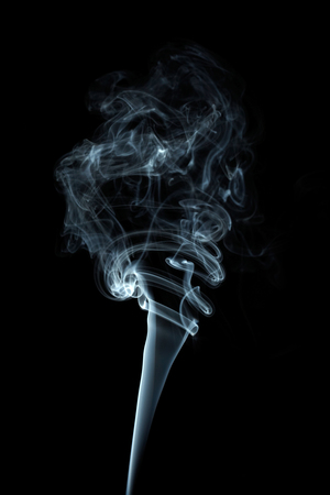 White smoke on black backgroundの写真素材
