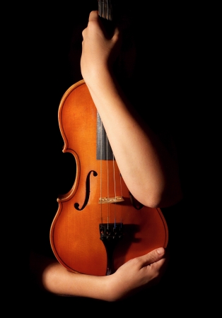 Old violin in woman handsの写真素材